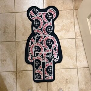 Graphic Bear Rug with Black, White & Red Script Design